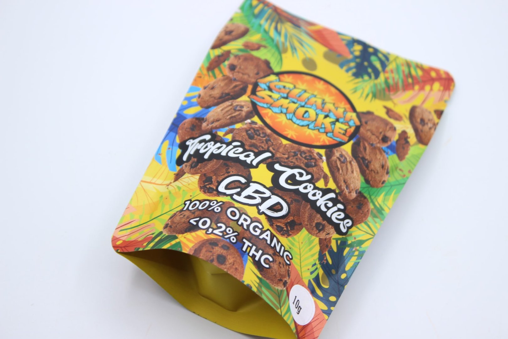 Envase Tropical Cookies Iguana Smoke, diseño colorido que representa un perfil terpénico potente y dulce